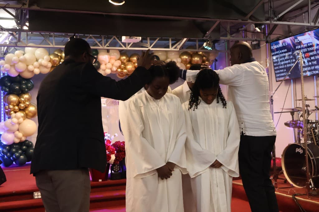 Prayer and blessing during baptism at Tabernacle of Glory